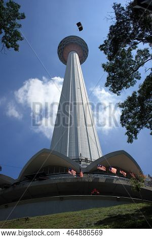Kuala Lumpur, Malaysia - August 24 2007: Man Base Jumping From The Kuala Lumpur Tower, A Notorious S