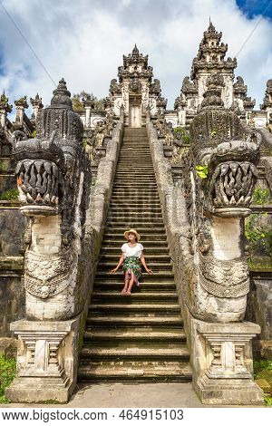 Woman Traveler At Ancient Gate At Pura Penataran Agung Lempuyang Temple On Bali, Indonesia