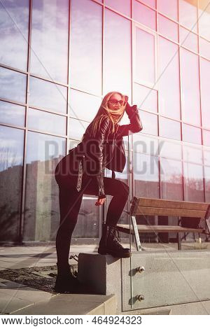 Fashionable Young Woman With Long Hair Wearing Solid Long Sleeve Bodycon One Piece Jumpsuits Posing 