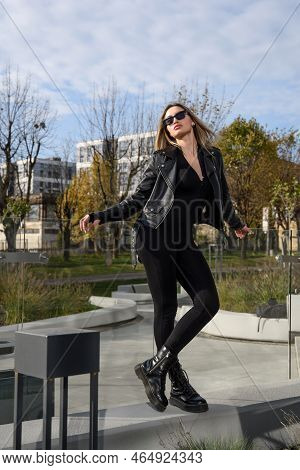 Fashionable Young Woman With Long Hair Wearing Solid Long Sleeve Bodycon One Piece Jumpsuits Posing 