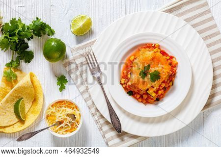 Vegetarian Enchilada Casserole Layered With Tortillas, Sauce, Pinto Beans, Corn, Zucchini And Mexica