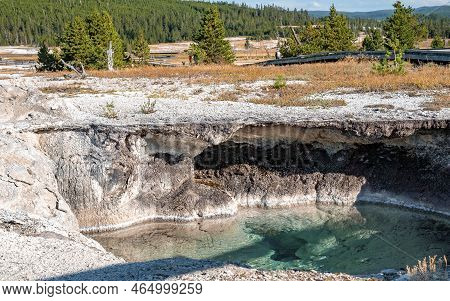 Beautiful Hotspring Amidst Geothermal Landscape At Yellowstone National Park