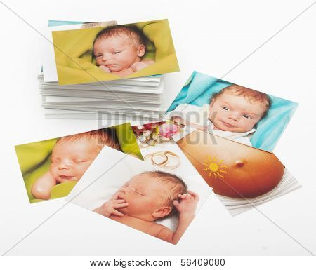 Pile of photographs on white background