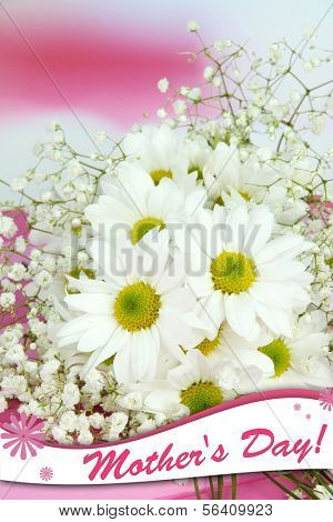 Beautiful flowers on table on bright background