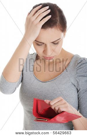 Beautiful casual woman showing her empty wallet. Isolated on white.