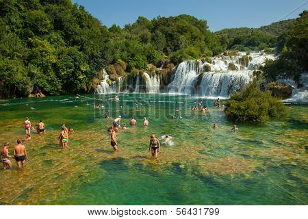 KRKA NATIONAL PARK, CROATIA - JUL 28: Tourists swimming in a river on July 28, 2012 in Krka National Park, Croatia. One of the most famous Croatian tourist attractions.