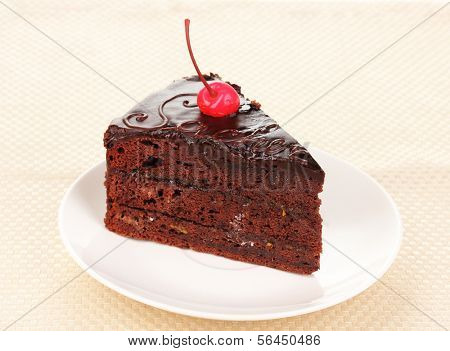 Chocolate sacher cake close-up on napkin