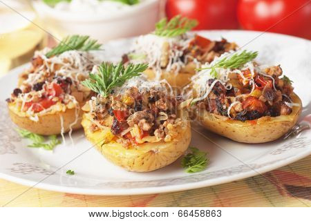 Oven roasted potatoes stuffed with ground beef and vegetables