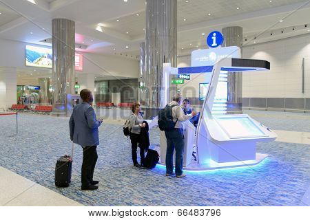 DUBAI, UAE - MARCH 30: airport information kiosk on March 30, 2014 in Dubai. Dubai International Airport it is a major airline hub in the Middle East, and is the main airport of Dubai.