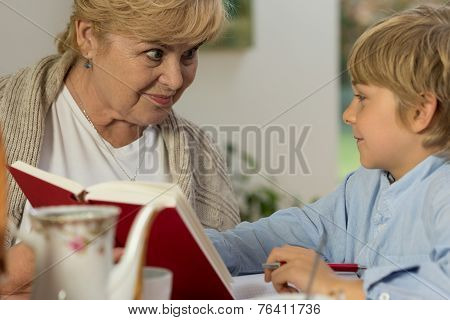 Senior Babysitter Caring About Schoolboy