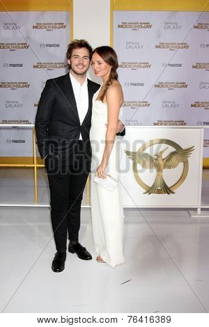 m LOS ANGELES - NOV 17:  Sam Claflin, Laura Haddock at the The Hunger Games: Mockingjay Part 1 Premiere at the Nokia Theater on November 17, 2014 in Los Angeles, CA