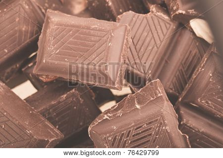 Pieces of milk chocolate closeup. Macro photo
