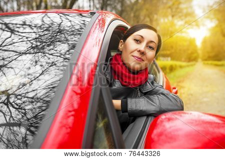 Girl Driving A Red Car.