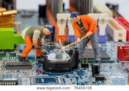 computer board and workers, symbolic photo for computer failure, maintenance, data security