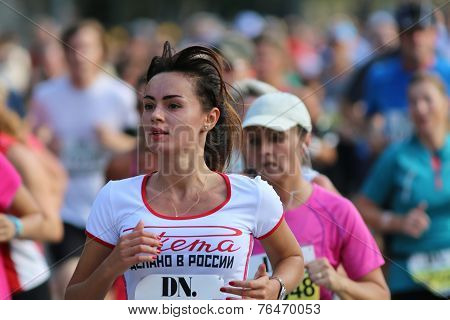 Young Beautiful Woman Running