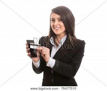 Smiling attractive elegant woman paying with smartphone