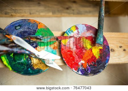 Paints and brushes in atelier