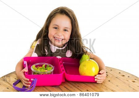 Cute little brunette girl with her healthy lunchbox