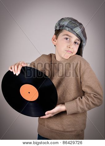Young boy holding a vinyl record