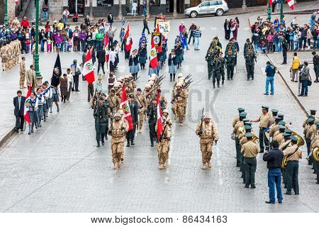 Cuzco, Peru - July 14, 2013: Peruvian  soldiers parading in the Plaza de Armas at Cuzco Peru