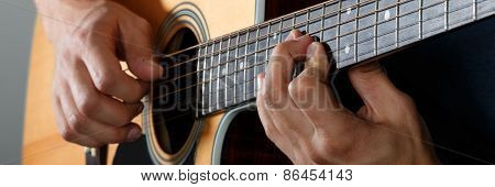 Acoustic Guitar Player Performing Song