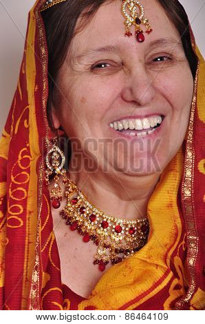 Happy Laughing Senior Woman In Traditional Indian Clothing And Jeweleries