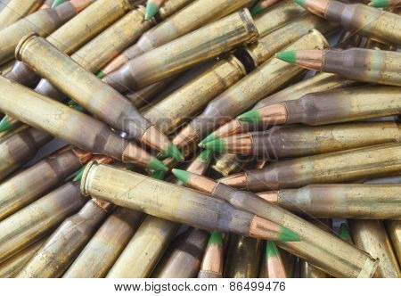 Pile Of Cartidges With Green Tipped Bullets