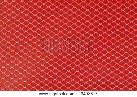 Background of red steel grating. Metallic background.