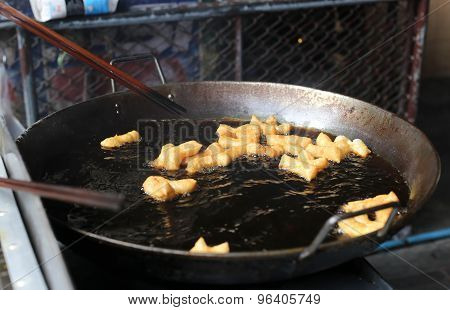 Chinese tradition deep fired bread stick snack in big pan