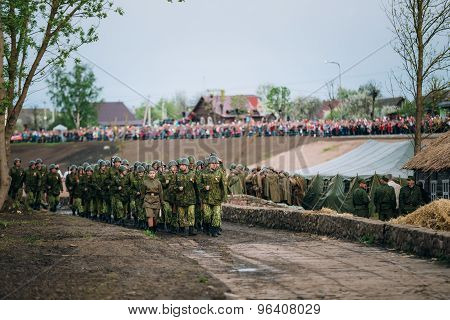 Parade of unidentified re-enactors dressed as Soviet soldiers du
