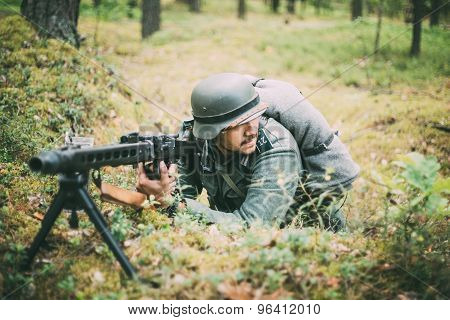 Unidentified re-enactor dressed as German soldier machine-gunner
