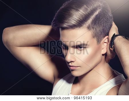 Handsome young man. Fashion young model man portrait. Handsome Guy. Vogue style image of elegant boy. fashion Hairstyle, haircut. 