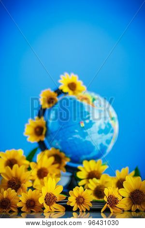 Globe With Books And Flowers