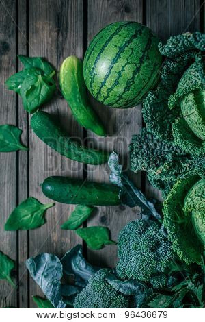 Various Green Vegetables On Wooden Table