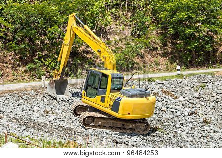 Excavator Digging Rock On Constriction Site