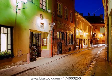 Street in night lighting in the historic center of the old town. Lithuania. Vilnius.