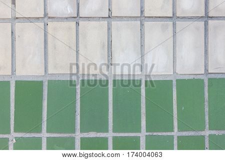 Facade of green mat ceramic tile texture. Geometric figures. Rectangles.