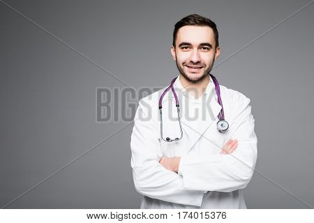 Portrait young medical doctor on grey background