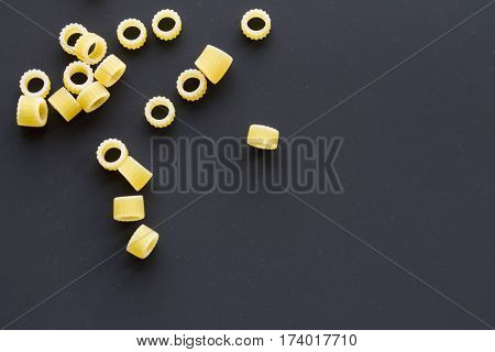 Pasta Rings On A Black Background