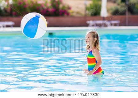 Child In Swimming Pool On Summer Vacation
