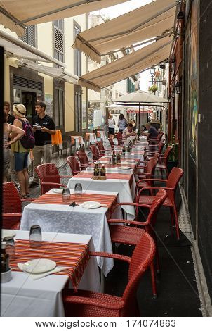 FUNCHAL MADEIRA PORTUGAL - SEPTEMBER 8 2016: Shops bars and restaurants in Santa Maria Street in Funchal town on Madeira Island. Portugal