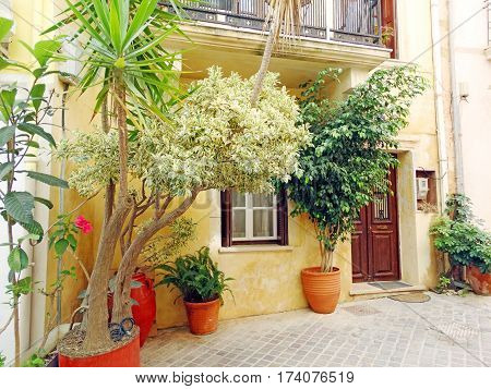 door architecture detail in house building with bougainvillaea Greece