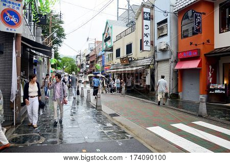 Japanese People And Traveler Foreigner Walking In Small Alley Near Higashimuki Shopping Street For T