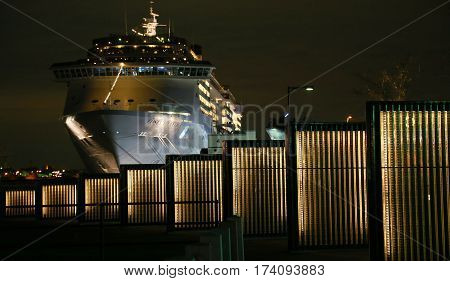 Night view of the illumination of a passenger ship and the park of the Japanese port