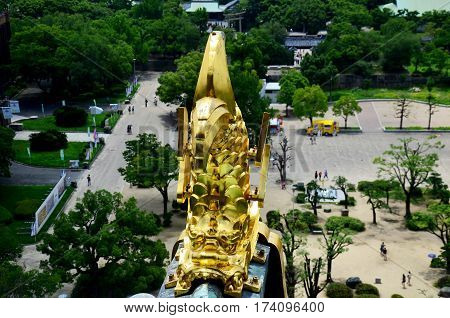 Golden Dragon Fish Statue Or Shachihoko At Roof Top And Aerial View Around Osaka Castle