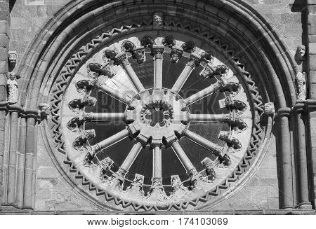 Avila (Castilla y Leon Spain): facade of the historic Santa Teresa church: rose window. Black and white
