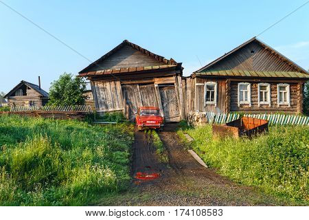 VISIM/ RUSSIA - JUNE 22, 2015. Ramshackle country house with garage and bath. Old believer village Visim, Sverdlovsk oblast, Russia.