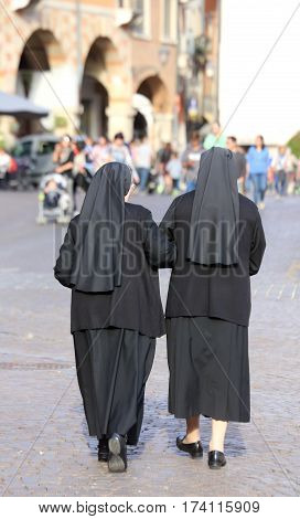 Two Nuns Blacks With Long Dresses And A Veil To Cover The Hair
