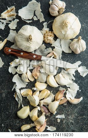Peeled fresh garlic on kitchen table. Top view.