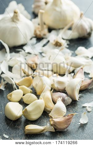 Peeled fresh garlic on kitchen table.